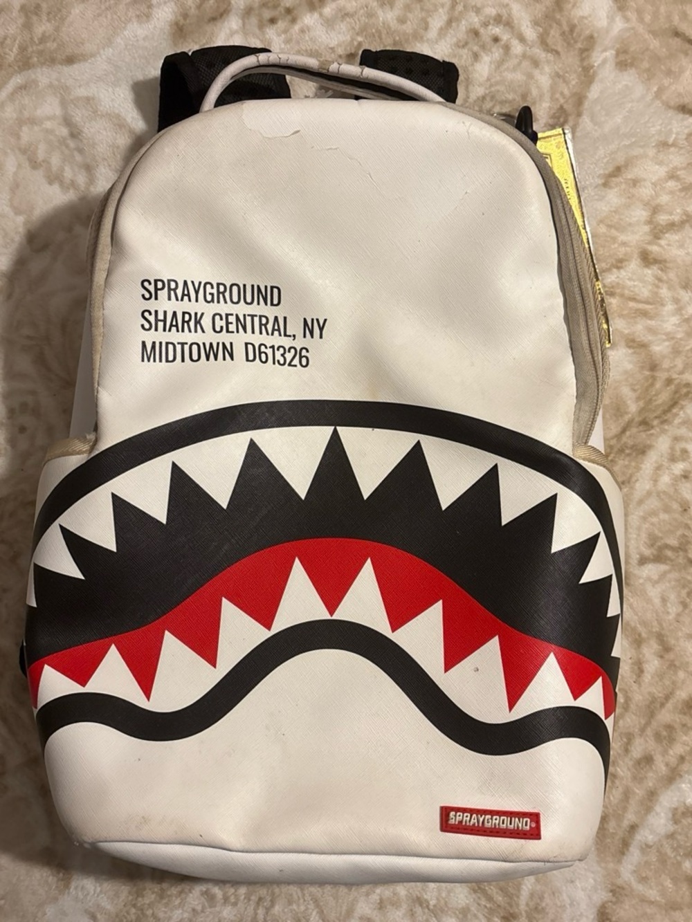 Sprayground White Backpack with Black and Red Shark Mouth Graphic